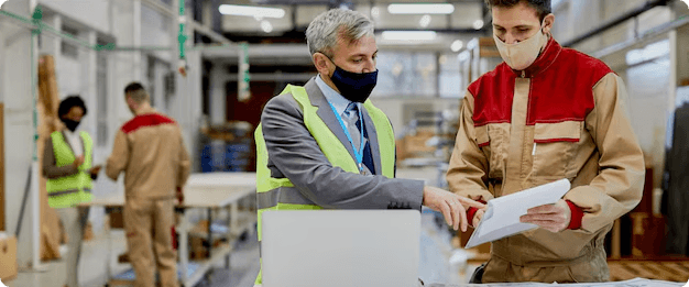 Factory workers discussing